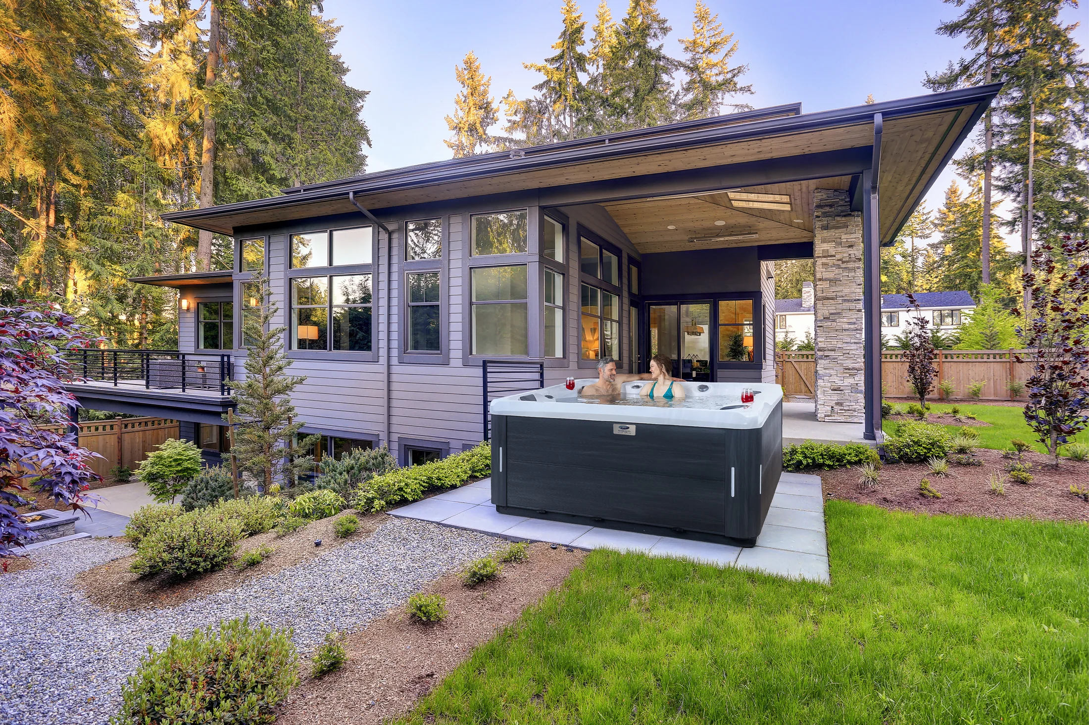 Outdoor hot tub beside a modern home